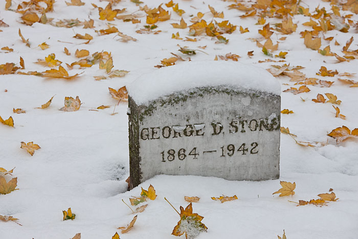Maple leaves litter the snow around the tombstone of George Stone, a man who saw the end of the Indian Wars and who lived through...