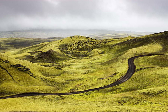 A road winds its way across the undulating hillside of moss-covered lava and soil. &nbsp;I never knew that such a broad and mountainous...
