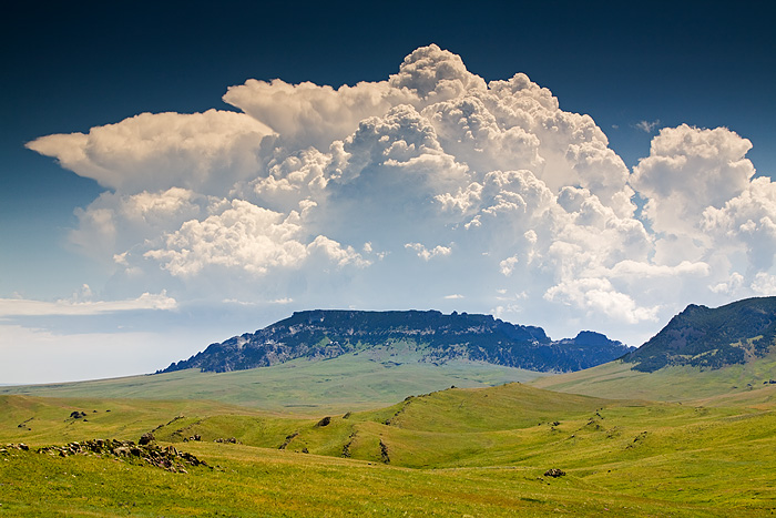 A thunderhead forms in the afternoon of a hot summer day over Square Butte in central Montana.&nbsp;