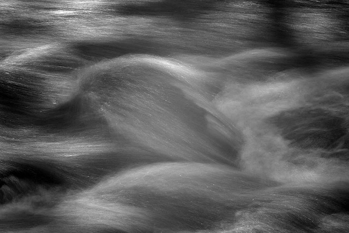 The movement of a fast-flowing river over rocks can create wonderful abstract patterns, especially if the light is &quot;just...