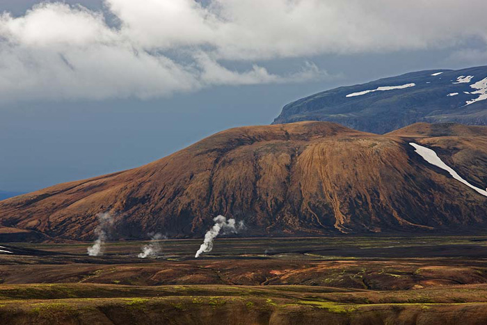 Steam rises from a geologically active area in southern Iceland. &nbsp;This reminded me of Yellowstone National Park in Montana...