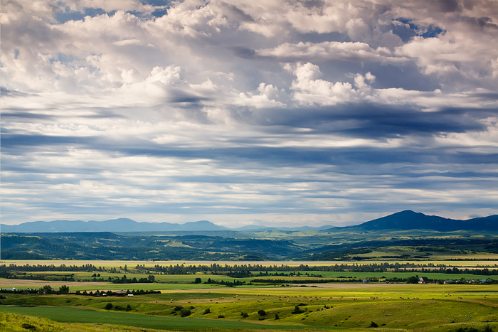 The dramatic clouds, broad vistas, and scattered farmhouses of central Montana made for an attractive composition. &nbsp;Scenes...